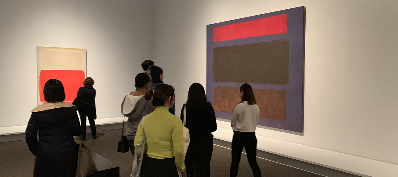 Students participating in the Art New York program view paintings at the Guggenheim Museum