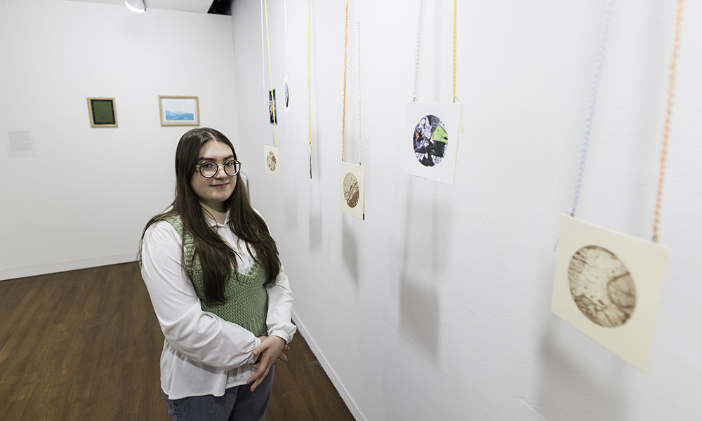Gabrielle Meli '22 presented an interdisciplinary thesis exhibition at the end of the 2022 spring semester called Birefringence—a phenomenon that occurs when plane-polarized light passes through minerals under a microscope. (University of Rochester photo / J. Adam Fenster)