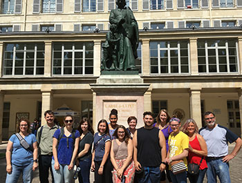 Students in front of a statue in Paris