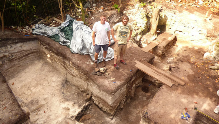Michael Jarvis and history graduate student James Rankine stand at the Oven Site excavation on Smiths Island in Bermuda.