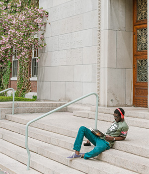 Student Reading on Steps