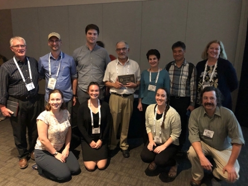 Gautam Mitra, center, with colleagues, former and present students at this year's meeting in Phoenix, Arizona