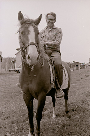 Russell Peck riding a horse