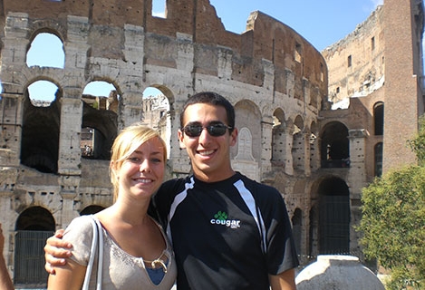 Student in front of ancient Italian monument