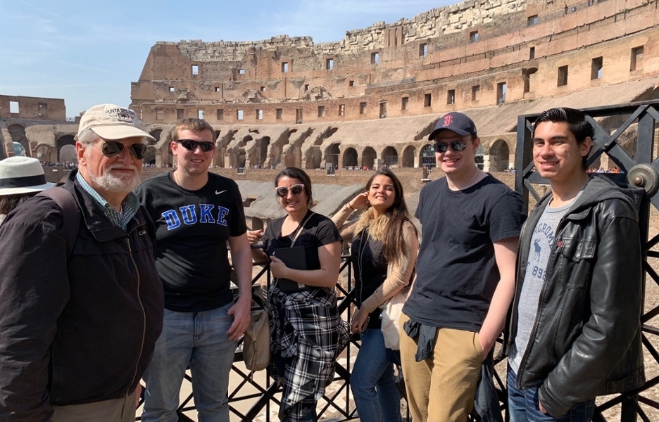 Students and faculty in front of the Colosseum.