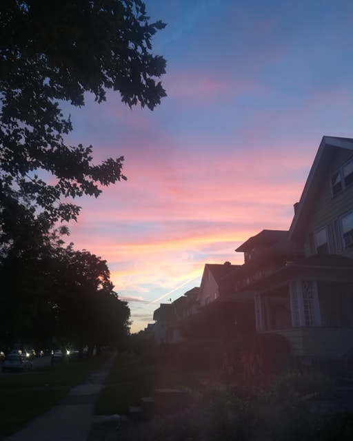 sunset over houses