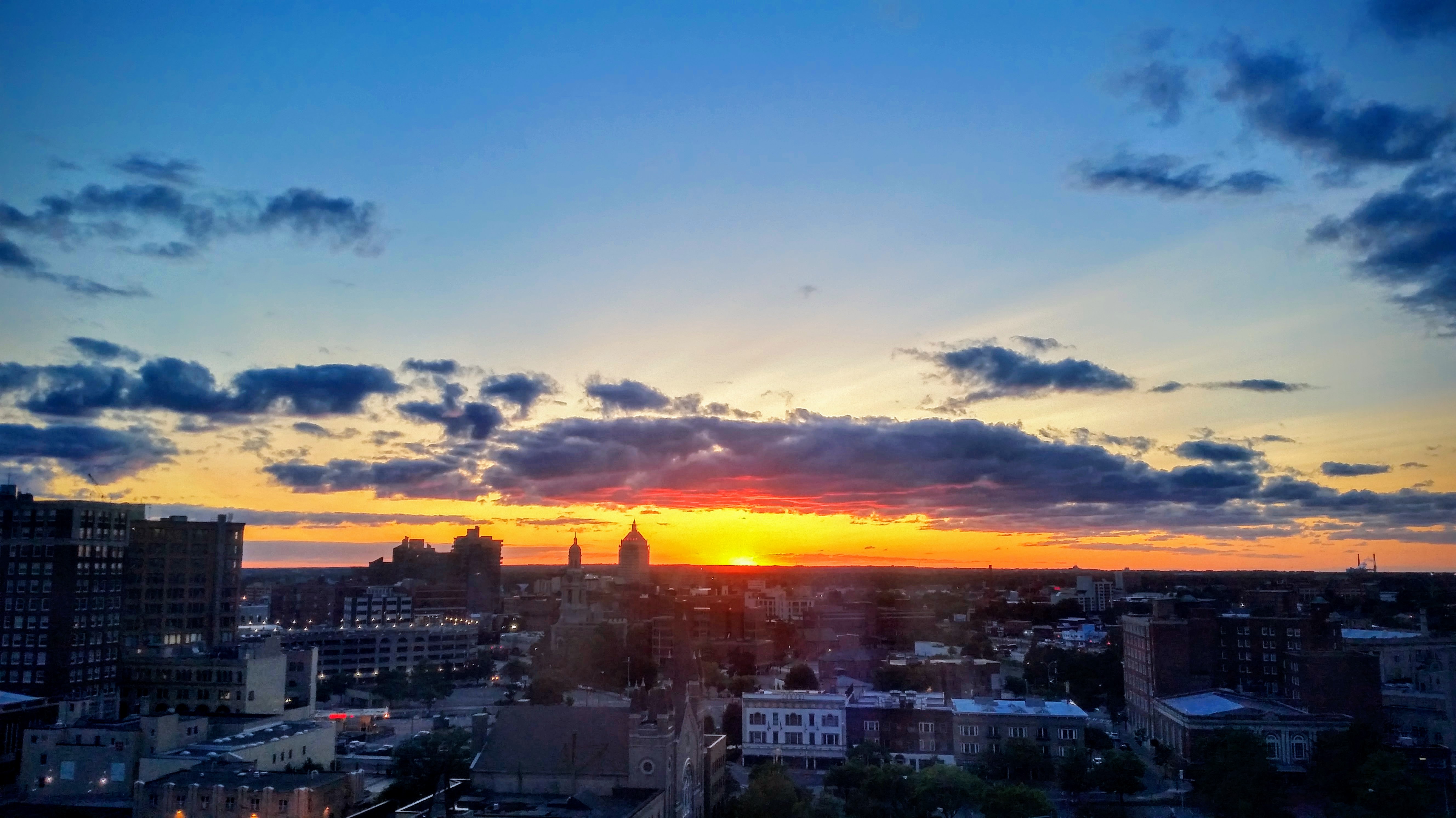 sunset over Rochester city skyline