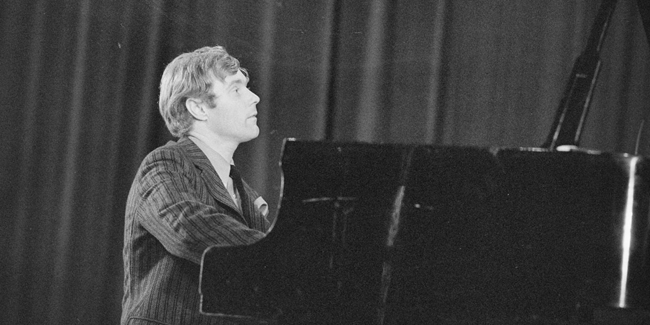 Krzysztof Trzcinski playing the piano.