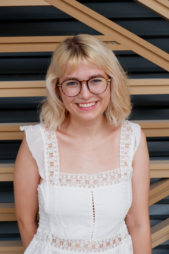 Emily Broad smiling at the camera.