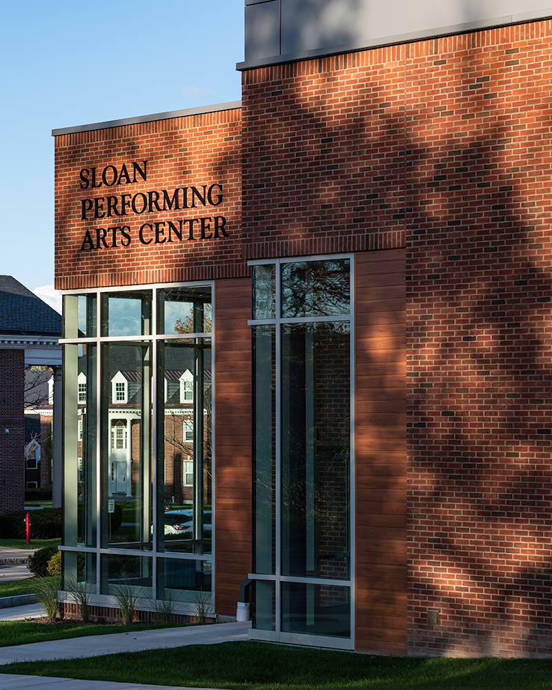 A view of the Sloan Center's name on the outside of the building.