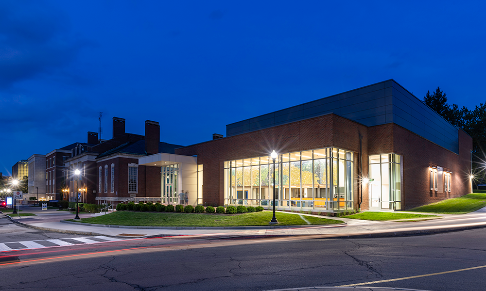 An exterior view of the Sloan Center at dusk.