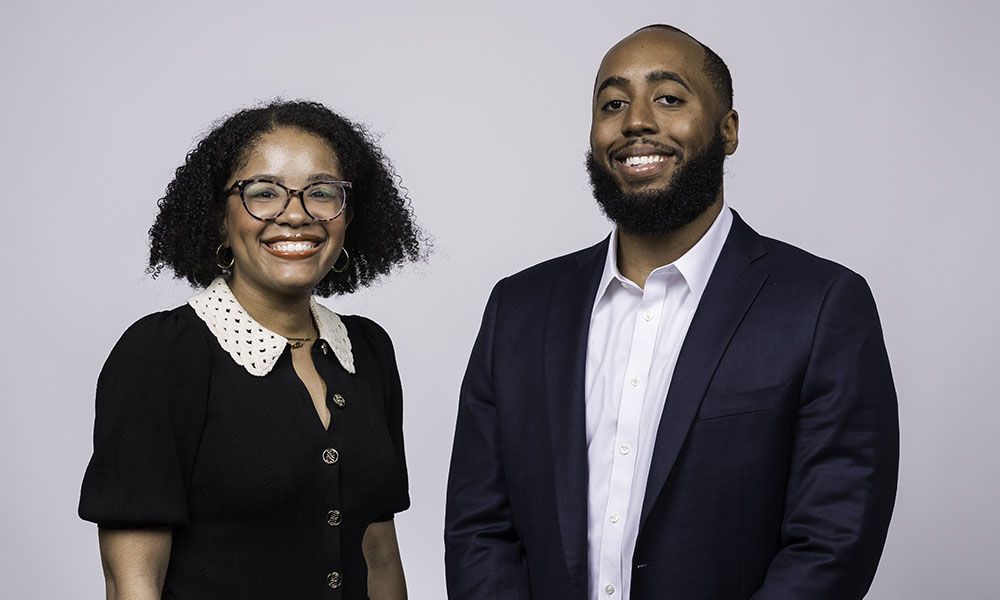 From left: Jordan Ealey and Philip V. McHarris smiling at the camera.