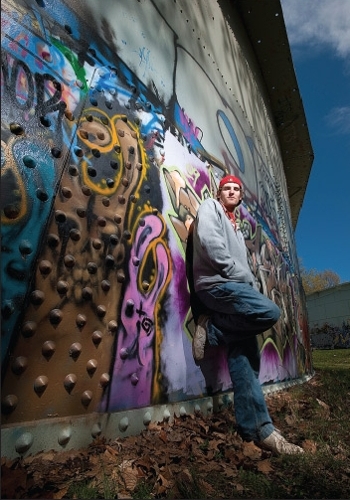 Student pictured at the water towers near Cobbs Hill Park.