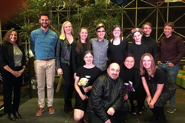 A large group smiling for the camera.