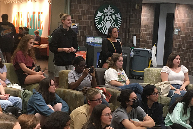 A large group gathered for an event in Starbucks.
