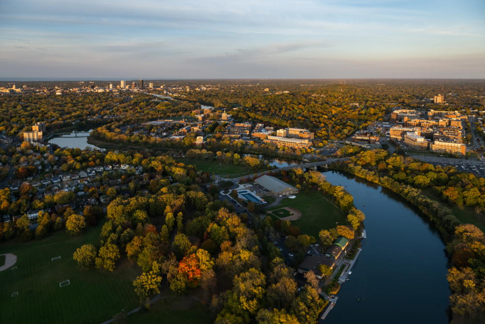 An aerial view of the River Campus with the City of Rochester in the background.