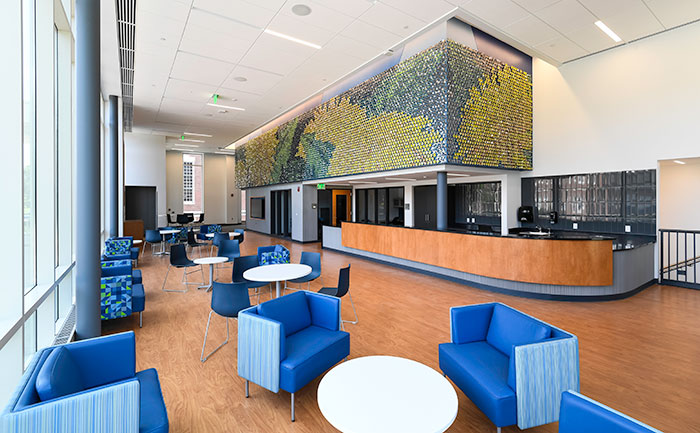 The lobby of the recently-completed Sloan Performing Arts Center, featuring in installation by the artist Jay Yan that includes approximately 8,000 stainless steel pieces set in a computer-generated pattern.