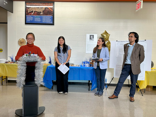 christina wang speaking at the podium