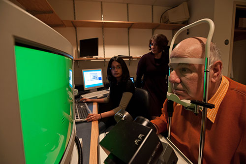 Neuroscience students working in a lab with a patient.