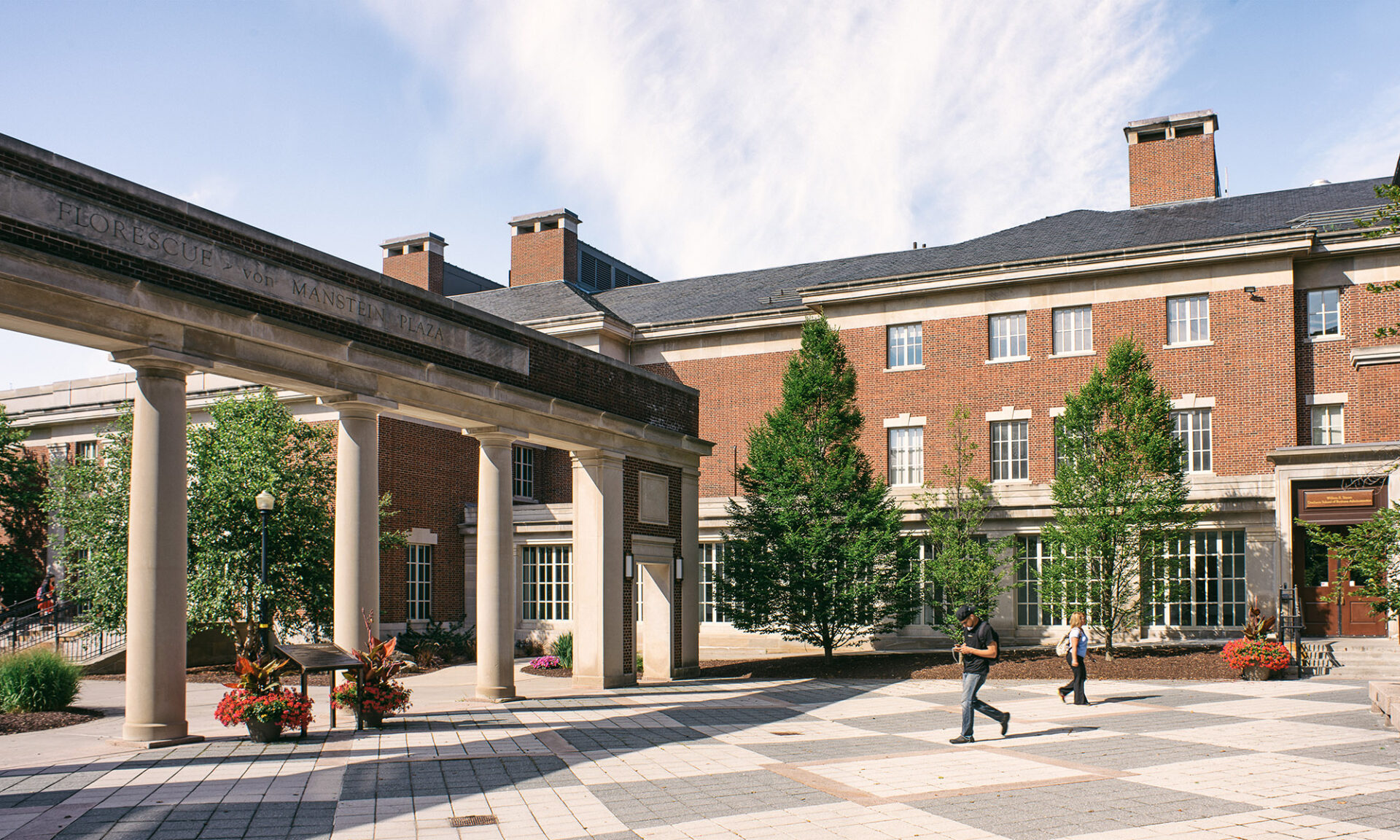 Plaza outside of a brick academic building.