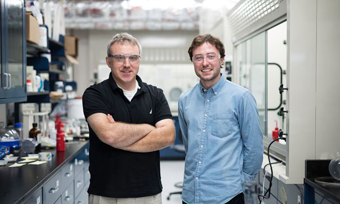 Take Five student Austin Bailey (right) is pictured in the lab of chemistry professor Todd D. Krauss (left).