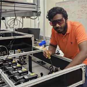 The student working on a piece of equipment.