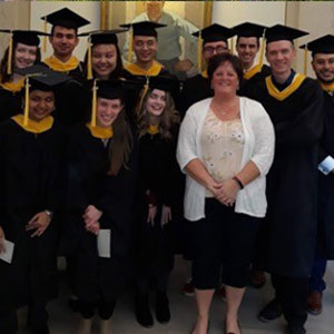 Robin Clark with a group of graduating students.