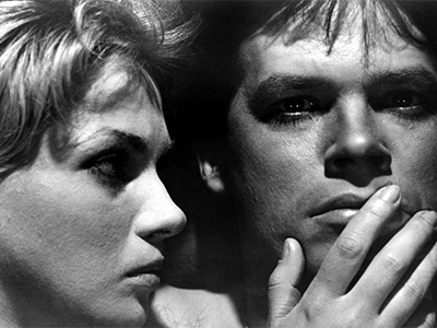 A still image from the film of a close up of two faces.