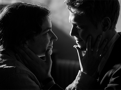 A still image from the film of a man and woman in an embrace.