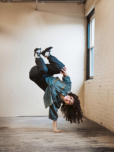 Stacy doing a one-handed hand stand.