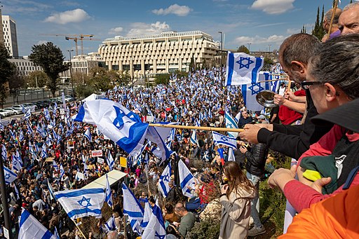 Protestors against the judicial overhaul wave Israeli flags.