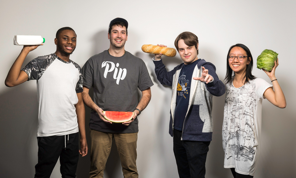 Digital media students posing with food.