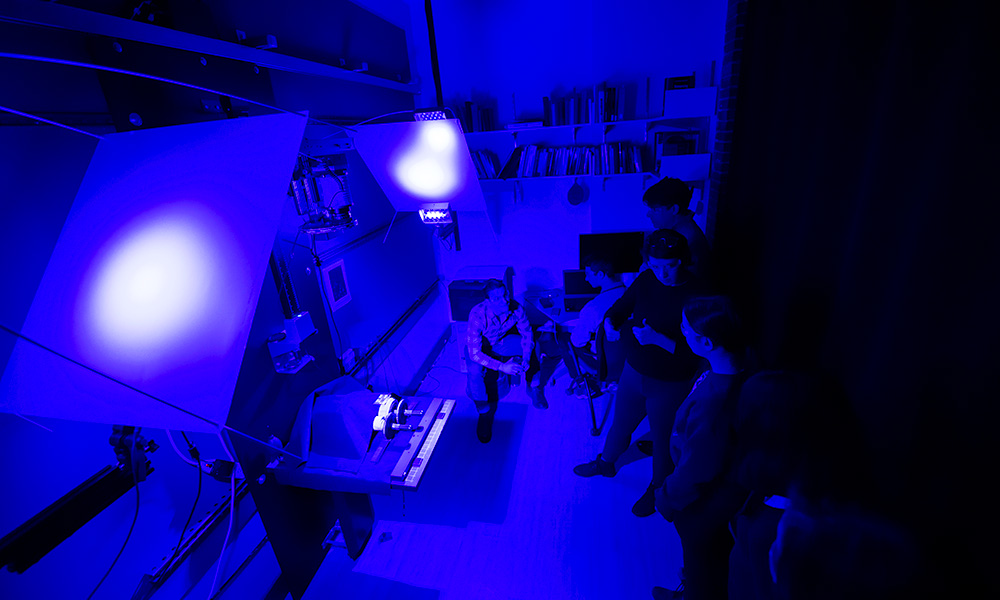 The professor and students using the scanner.