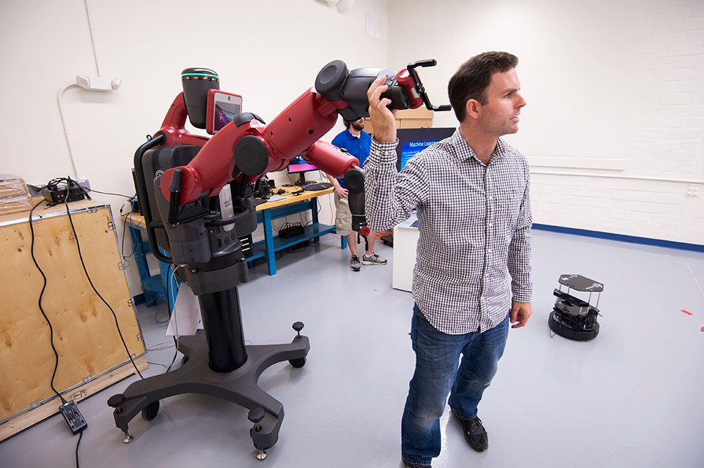 professor with robotic arm