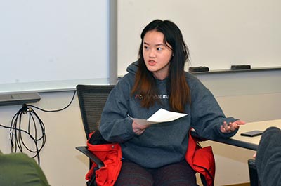 Yutong He, a senior in data science, makes a point during a debate.