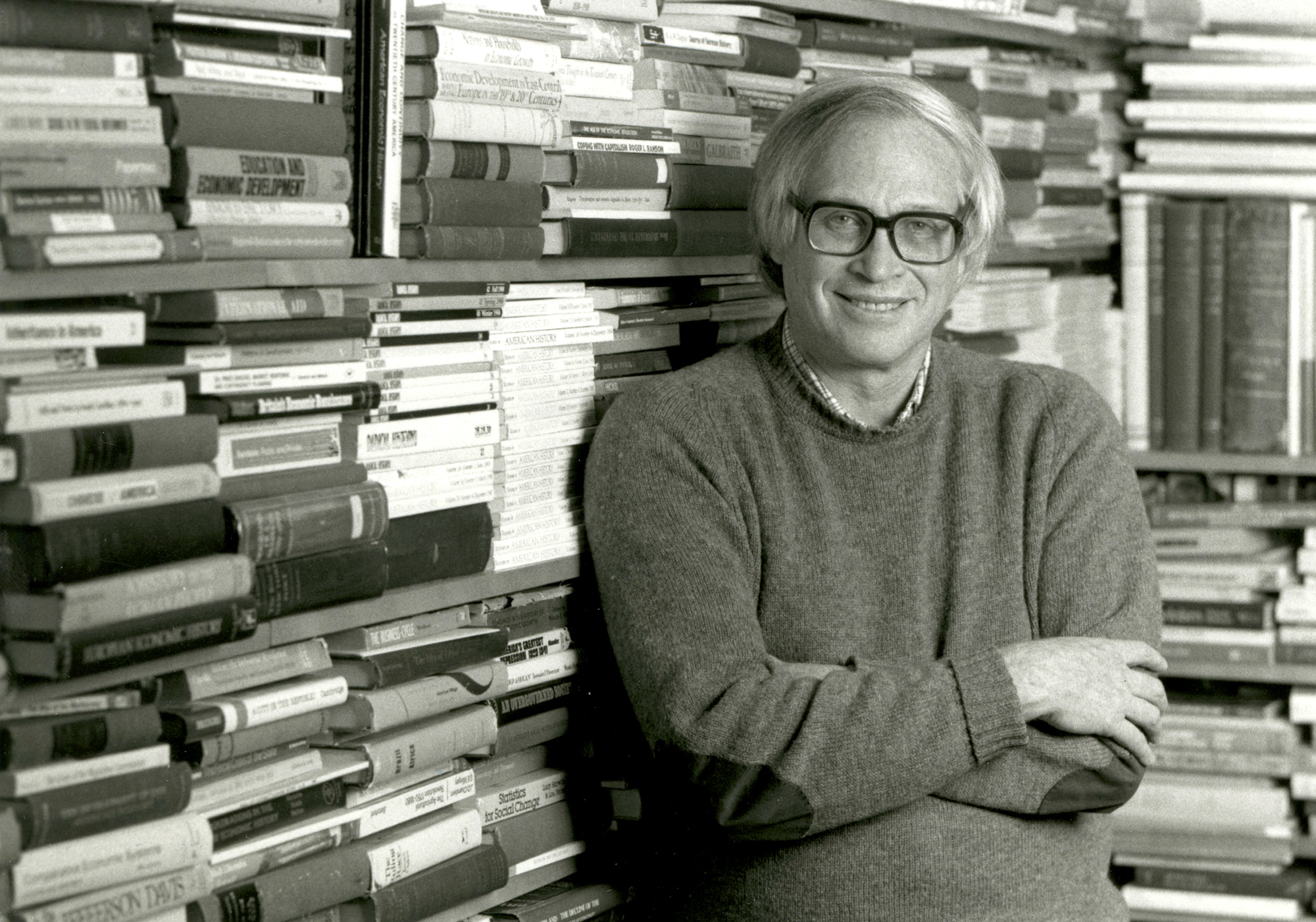 Stanley Engerman, seen here in a 1989 photo in front of his office bookshelves.