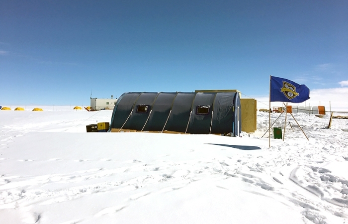The Meliora flag flies high at the Law Dome research station in Antarctica.