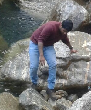 Wriju climbing rocks.