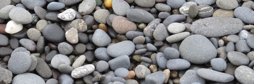 A close up of round, smooth pebbles.