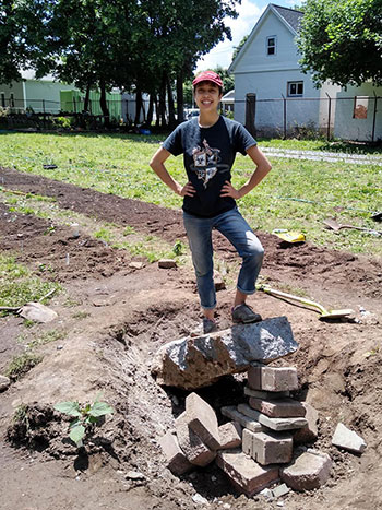 Mitch Klein working in a garden.