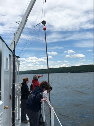 Students on a boat in the lake.