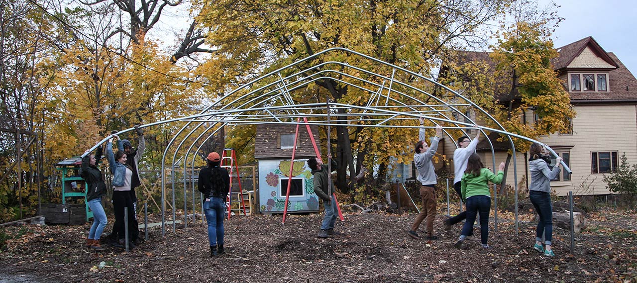 Students erecting a greenhouse