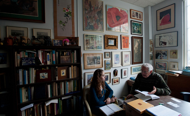 Russell Peck meets with student in his office