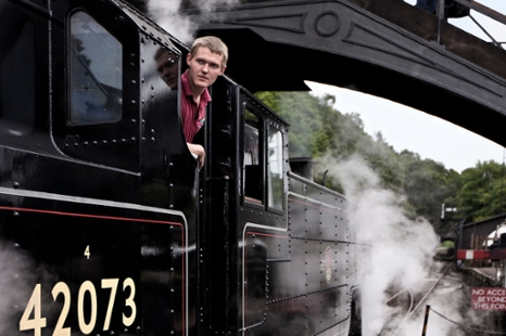 Image of a man on a steam train taken by FMS student Jin Li