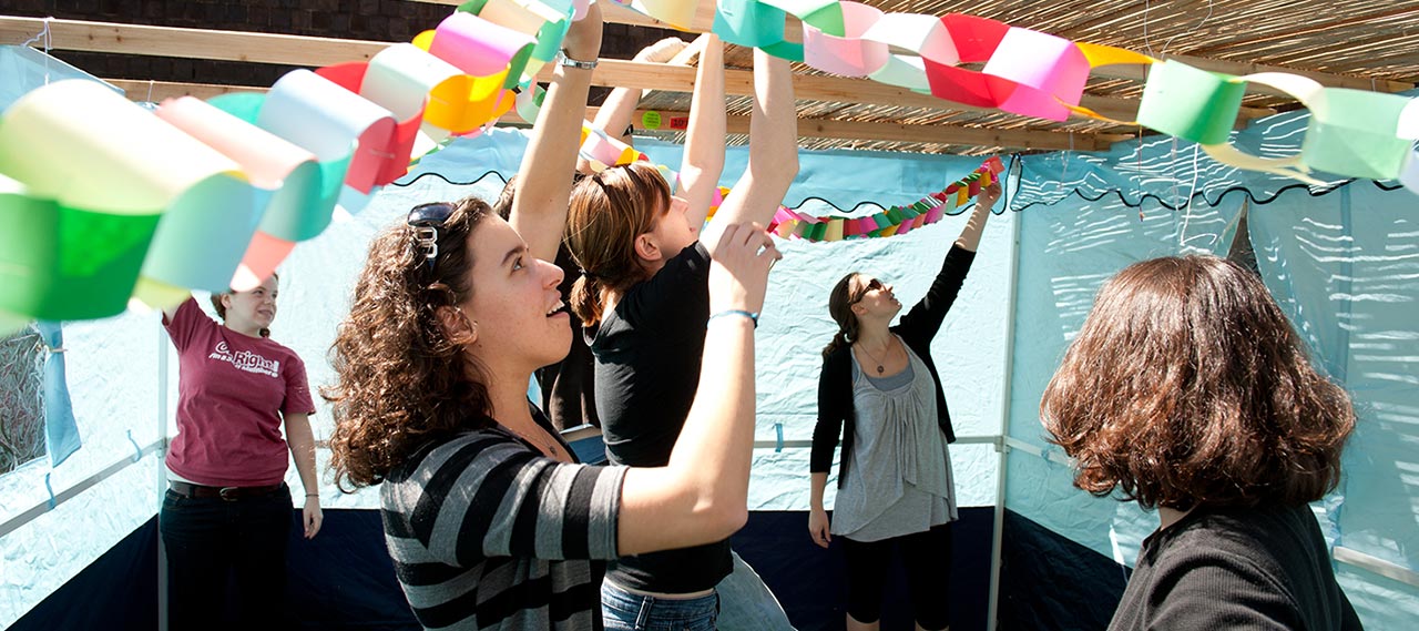 Students building a Sukkah during during the Jewish holiday of Sukkot.