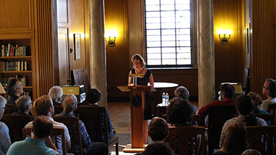 Professor speaking at a podium.