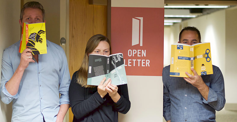 Three people reading books