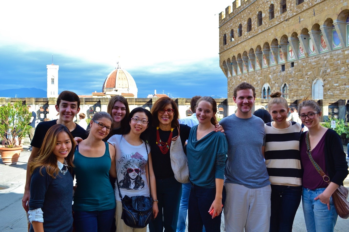 A group of students and an instructor pose for the camera.