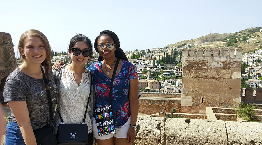 Three students posing in Granada.