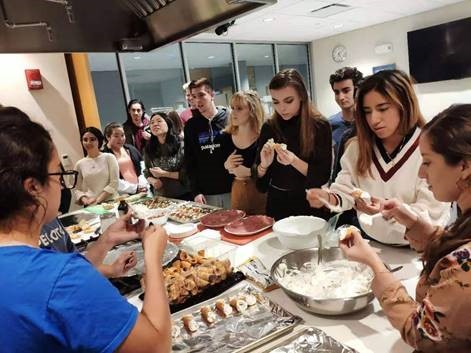 Students sampling food.